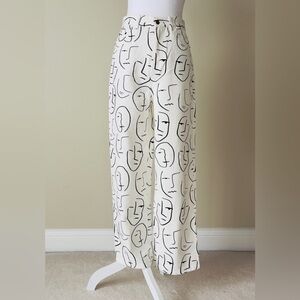 Shekou "Little Things" white denim jeans with a black abstract face print EUC